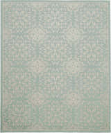Close-up of Nourison Jubilant Ivory Green rug featuring a floral medallion pattern on a soft green background.