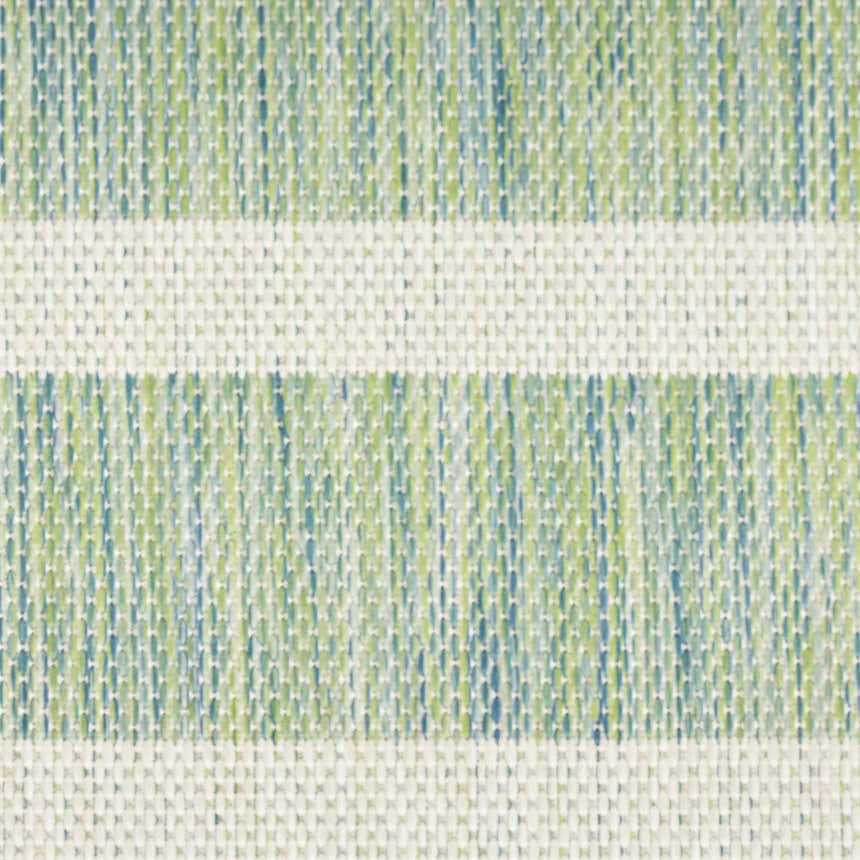 Close-up of the Nourison Positano Blue Green Ivory rug, showing the woven texture and striped pattern.