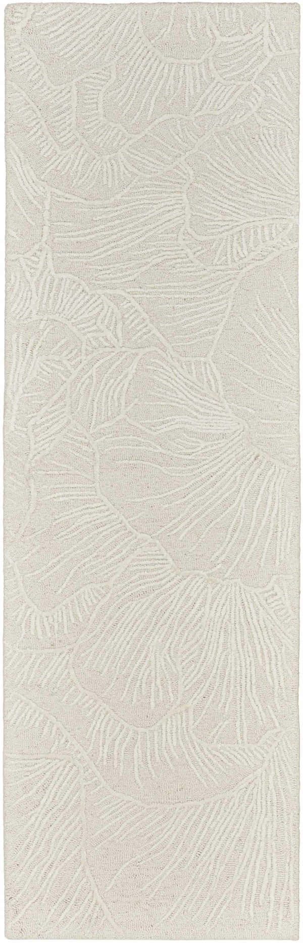 Close-up of the Nourison Avra Ivory rug. Creamy wool rug with a raised, abstract botanical design. Handmade texture.