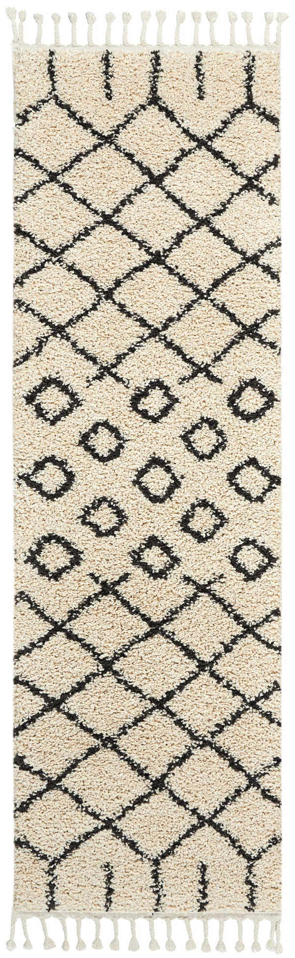 Close-up of Nourison Moroccan Shag Cream Tribal Indoor Area Rug with diamond pattern and fringe. Soft, textured shag rug.