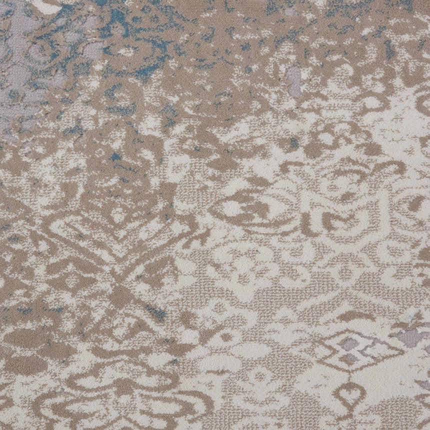 Close-up of Nourison Karma Ivory/Light Blue rug. Vintage style with chestnut, ivory, and blue tones. Machine-made texture.