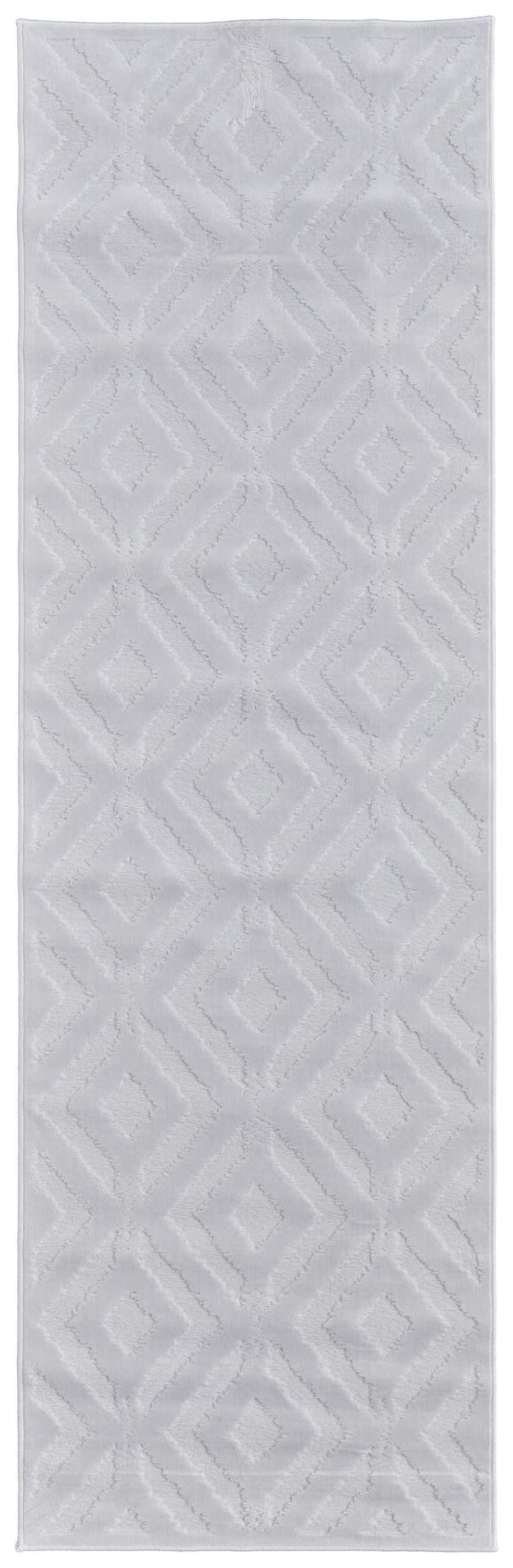Close-up of the Feizy Saphir Mira Modern Solid White Area Rug featuring a geometric diamond pattern and soft texture. Design-Runner