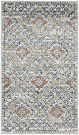 Close-up of the Nourison Quarry Blue Ivory Southwestern rug, featuring a chestnut, blue, and ivory diamond pattern.