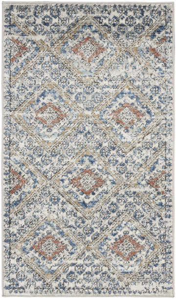 Close-up of the Nourison Quarry Blue Ivory Southwestern rug, featuring a chestnut, blue, and ivory diamond pattern.