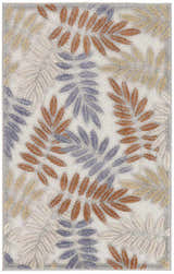 Close-up of Nourison Aloha Blue Mocha outdoor rug with a leaf pattern in blue, mocha, and beige.