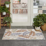 Entryway with Nourison Aloha Blue Mocha Outdoor Area Rug featuring a leaf pattern in blue, mocha, and cream.