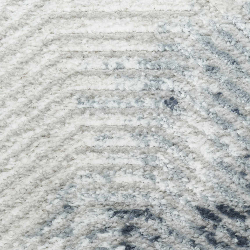 Close-up of the high pile Nourison Dekor Grey Navy rug, showing its soft texture and modern geometric pattern.