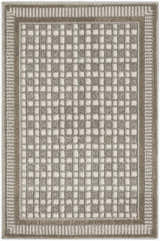 Close-up of Nourison Nordic Ivory Grey rug. Modern design with chestnut border and ivory and grey checkered pattern.