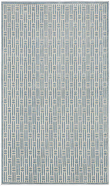 Close-up of Nourison Charm Blue Ivory rug featuring a modern geometric pattern with blue and ivory hues.