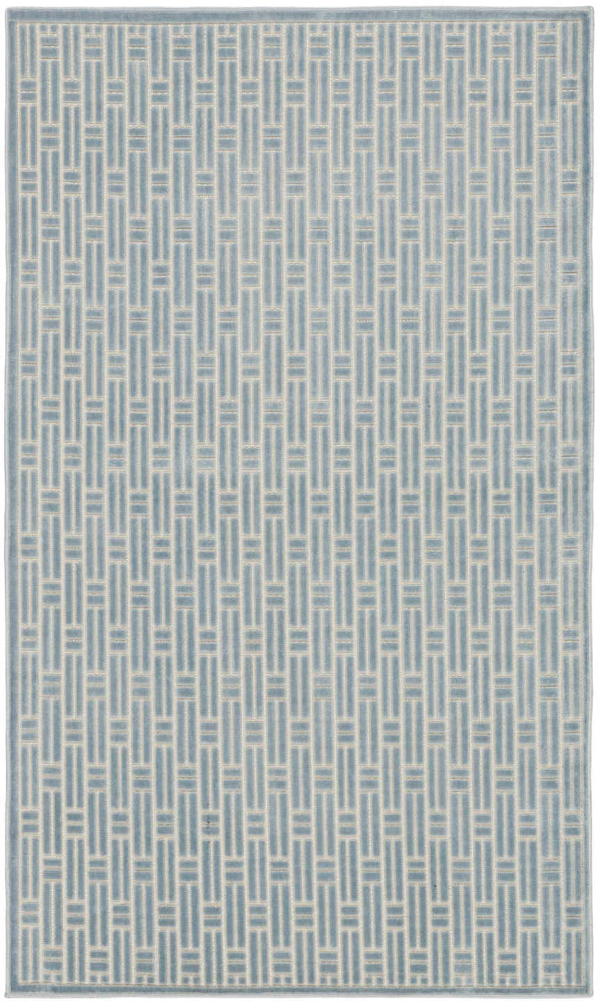 Close-up of Nourison Charm Blue Ivory rug featuring a modern geometric pattern with blue and ivory hues.