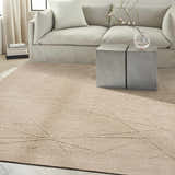 Modern living room with a neutral sofa and the Calvin Klein CK044 Wander Natural area rug.