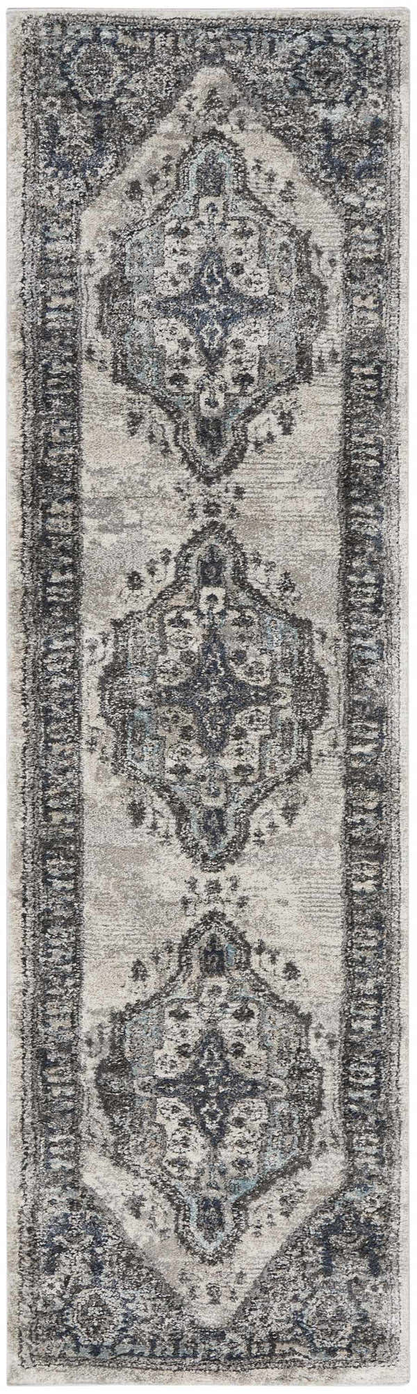 Close-up of the Nourison American Manor Grey Farmhouse Area Rug, featuring a distressed, traditional medallion pattern.