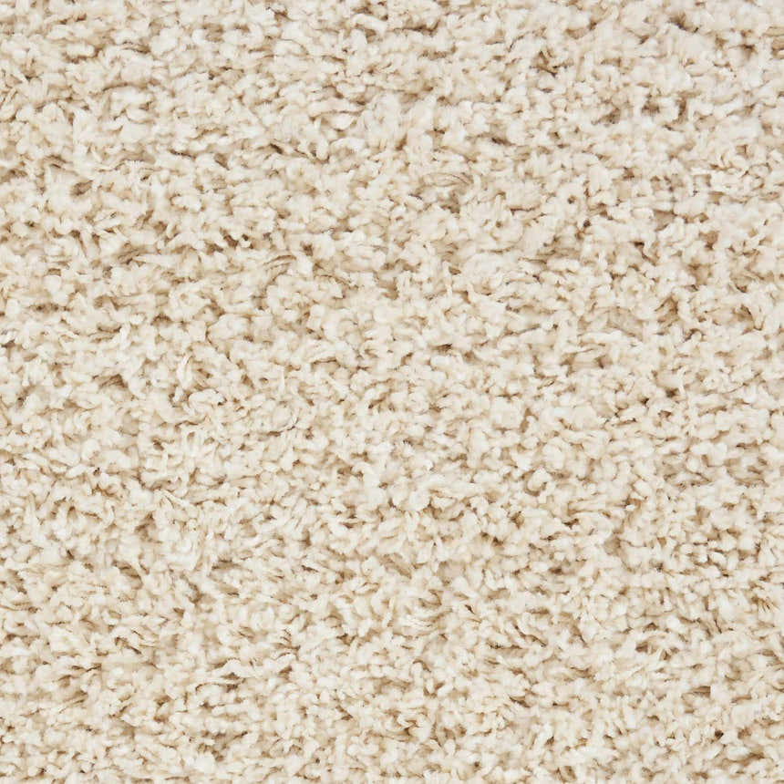 Close-up of the plush texture of the Nourison Amore Cream Shag rug. Soft, high pile shag rug in cream.