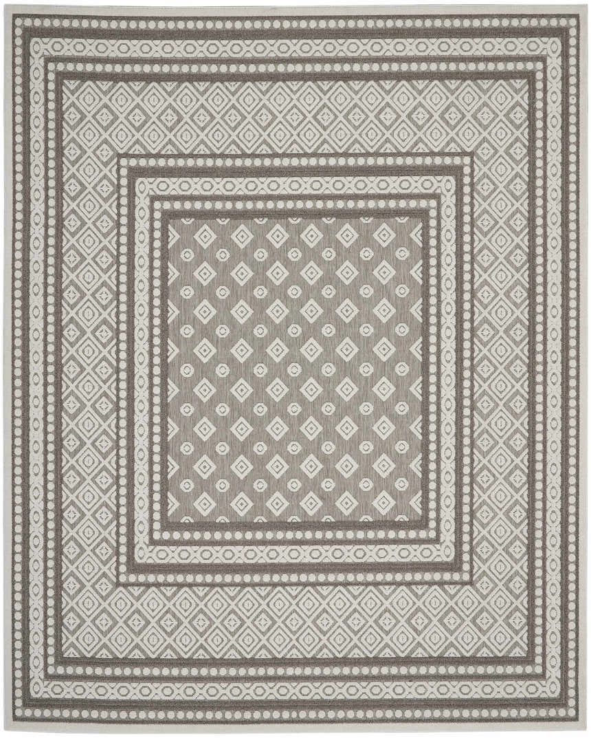 Close-up of the Nourison Key Largo Light Grey rug, featuring a diamond and circle pattern with farmhouse transitional style.