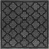 Close-up of the Nourison Easy Care Charcoal Black Modern Area Rug, featuring a quatrefoil pattern and textured weave.