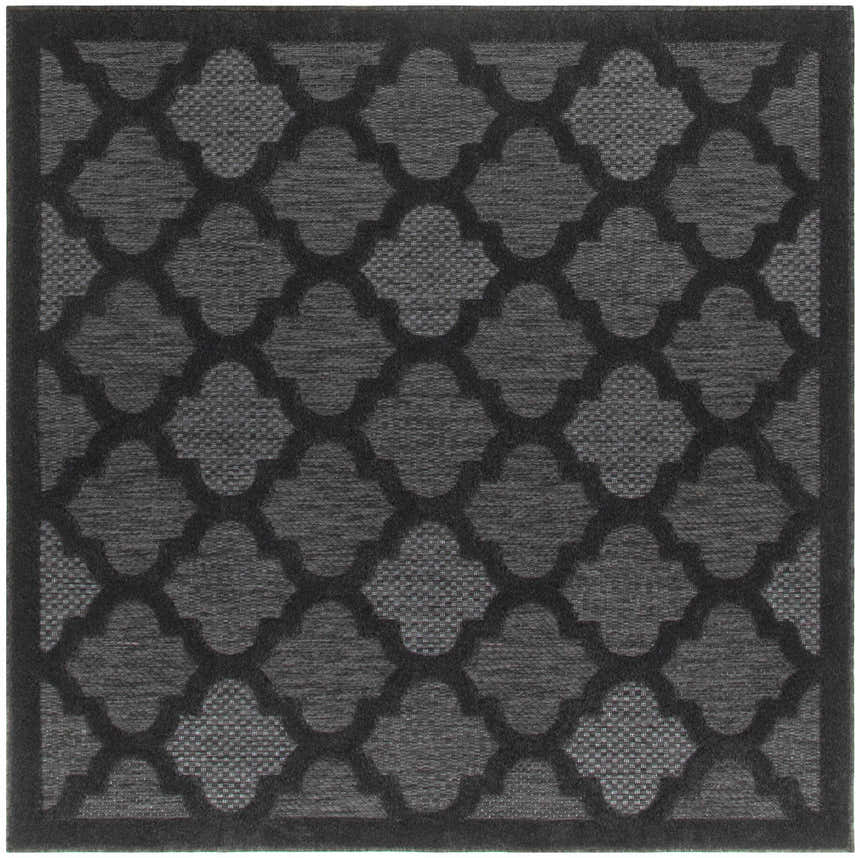 Close-up of the Nourison Easy Care Charcoal Black Modern Area Rug, featuring a quatrefoil pattern and textured weave.