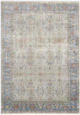Detailed view of the Nourison Starry Nights Grey Vintage Area Rug. Features a traditional floral pattern, blue and orange border, and distressed texture.