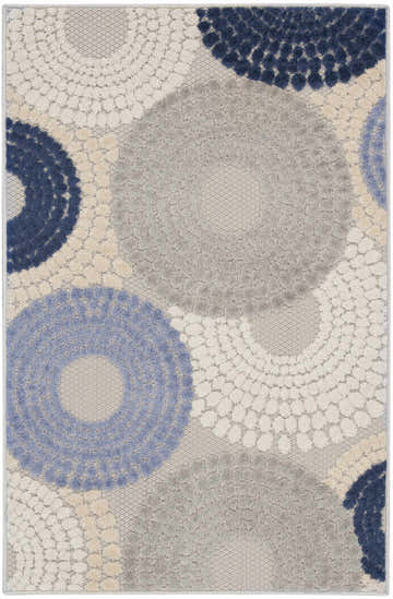Close-up of Nourison Aloha Blue Grey Modern Area Rug featuring a circular blue, gray, and cream pattern.