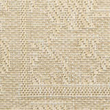 Close-up of the cream Nourison Tulum Outdoor Area Rug, showing woven texture and geometric pattern.