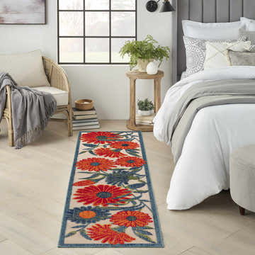 Bedroom scene with Nourison Aloha Ivory Multicolor runner rug, floral pattern, bright and airy.