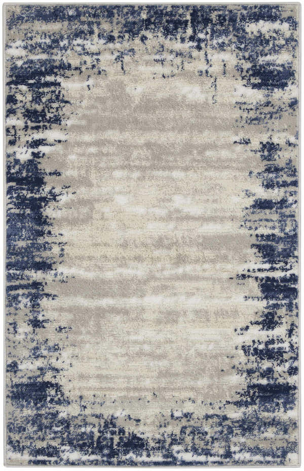 Close-up of the Nourison Cyrus Ivory Navy rug, featuring a distressed abstract border design in navy and chestnut.