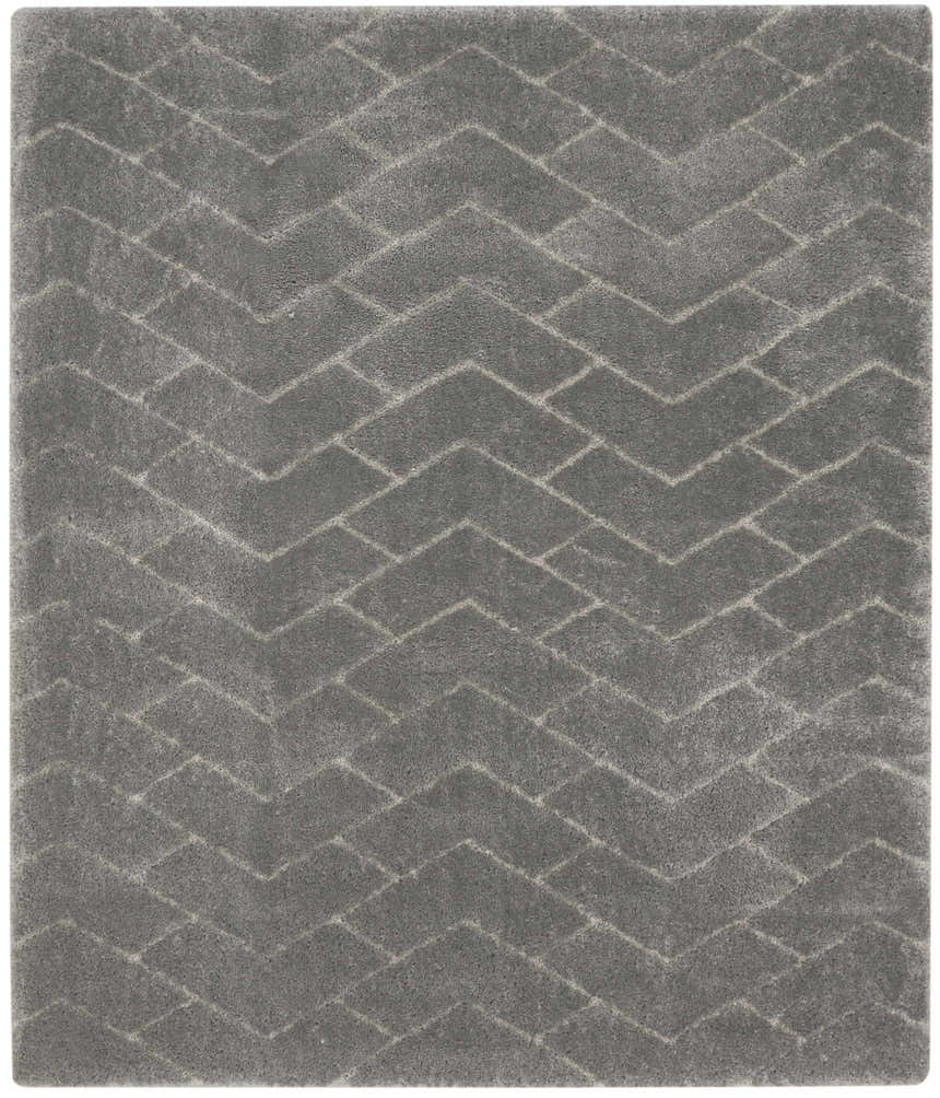 Close-up of the grey Nourison Dreamy Shag rug. Features a subtle chevron pattern and soft shag texture.
