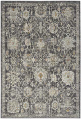Close-up of Nourison Oushak Home Charcoal Vintage Area Rug. Features floral taupe pattern on a dark gray background.