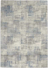 Close-up of Nourison Solace Ivory Grey Blue Rug. Modern high pile rug with blue and grey geometric pattern.