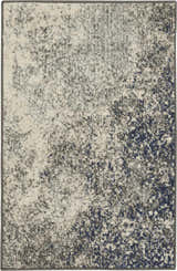 Close-up of the Nourison Passion Charcoal Ivory rug featuring a distressed taupe, ivory, and navy blue pattern.