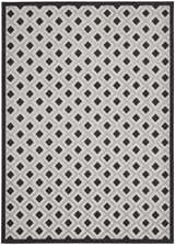 Close-up of Nourison Aloha Black White Modern Area Rug with geometric diamond pattern and black border.