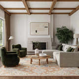 Living room with green chairs and Nourison Maison Rust Ivory Vintage Area Rug.