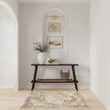 Entryway with a Nourison Astra Rust Vintage rug, console table, and neutral decor.