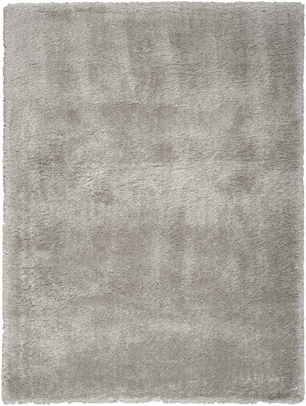 Close-up of a soft, silver gray Nourison Dreamy Shag rug. The rectangular rug has a plush, textured shag pile.