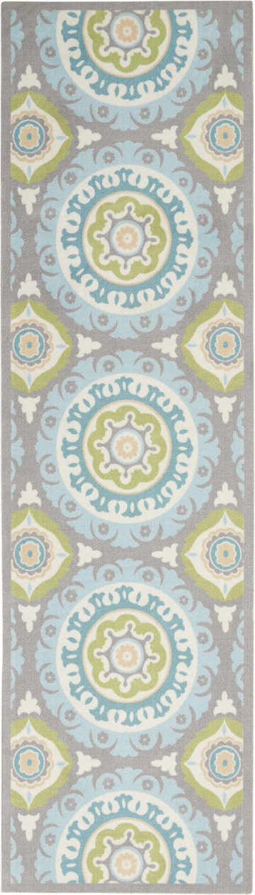 Close-up of Waverly Sun N' Shade Jade rug. Coastal runner with medallions in jade, blue, green, and beige on a gray background.