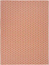 Close-up of the Nourison Twist Reversible Coral Modern Area Rug featuring a honeycomb pattern in coral and white.