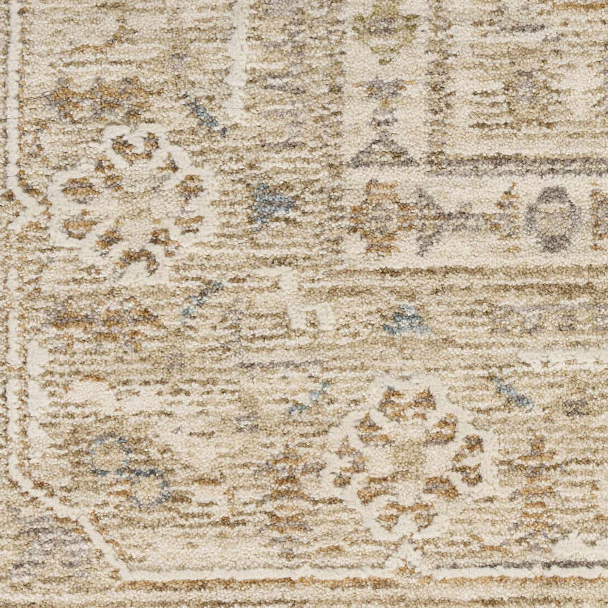 Close-up of the Nourison Retreat Mocha Vintage Area Rug, showcasing its light brown tones and textured, vintage-inspired pattern.