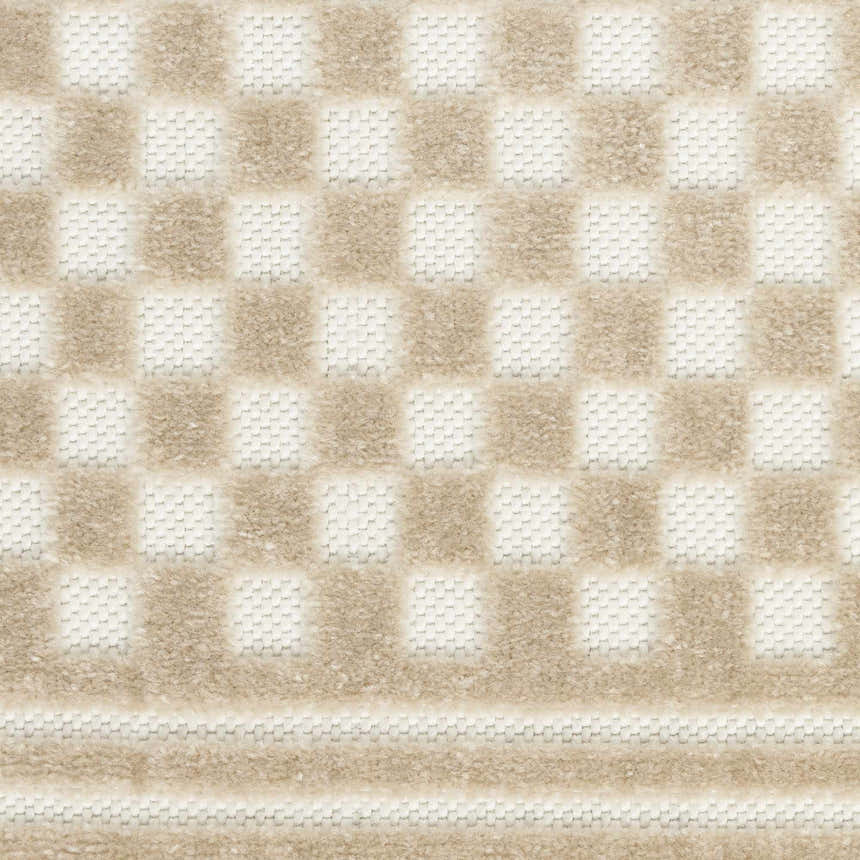 Close up of the beige checkerboard pattern on the Nourison Care Free Area Rug.
