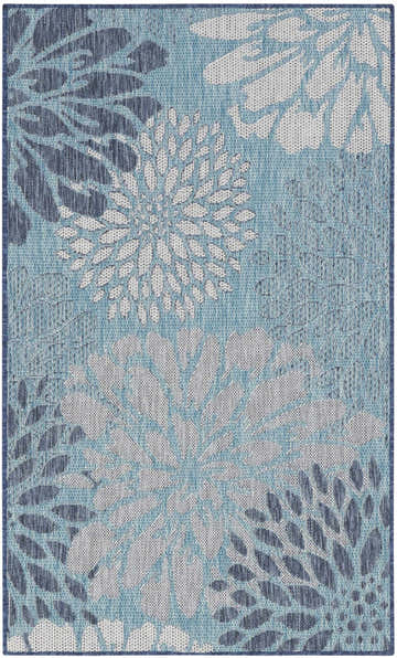 Close-up of the Nourison Garden Oasis Navy Tropical Area Rug featuring a blue floral pattern.