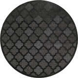 Close-up of a round Nourison Easy Care Charcoal Black rug featuring a quatrefoil pattern in shades of gray and black.