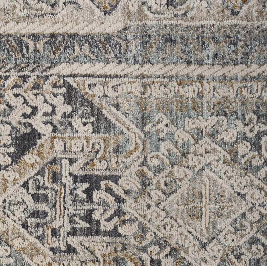 Close-up of Nourison Lynx Ivory Charcoal rug. Vintage design with taupe, charcoal, and ivory hues. Soft, textured pile.