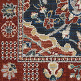 Close-up of the Nourison Parisa Multicolor rug, showcasing its traditional floral pattern in red, blue, and gold tones.