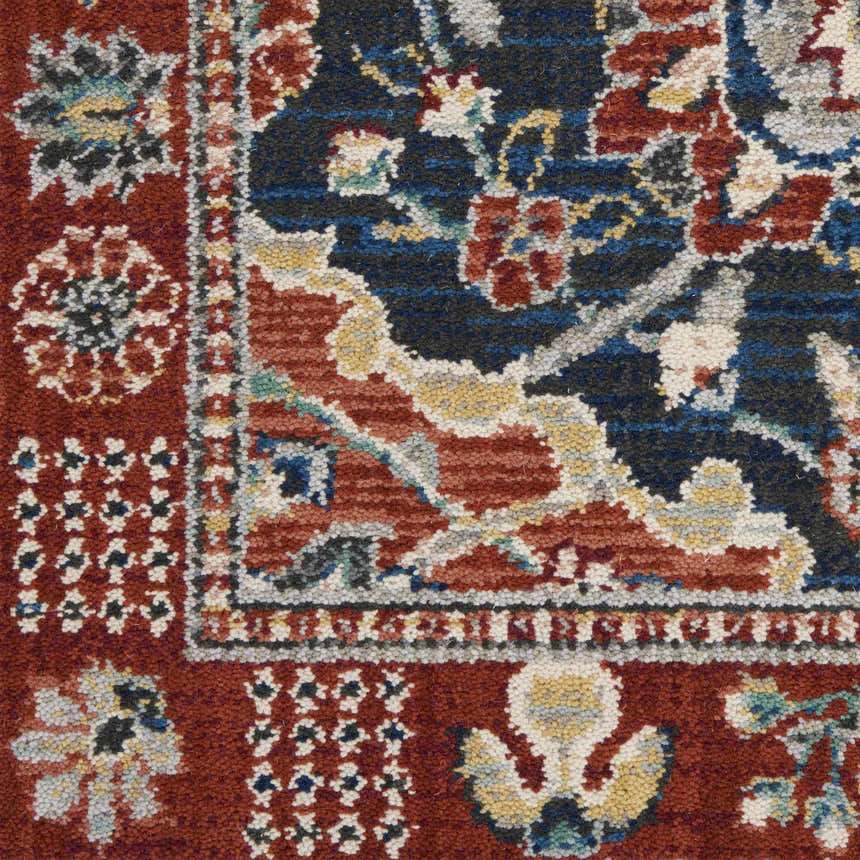 Close-up of the Nourison Parisa Multicolor rug, showcasing its traditional floral pattern in red, blue, and gold tones.