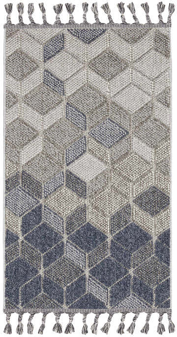 Close-up of the Nourison Paxton Grey Slate rug, featuring a geometric cube pattern and knotted tassels.