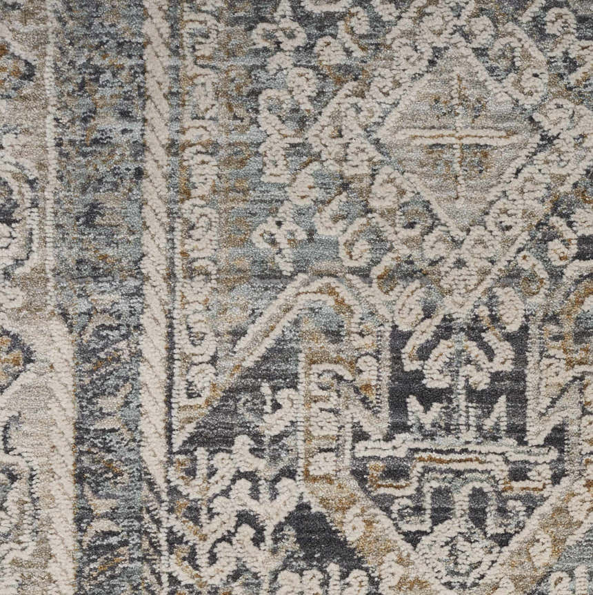 Close-up of the Nourison Lynx Ivory Charcoal rug. Vintage design with taupe, charcoal, and ivory hues.
