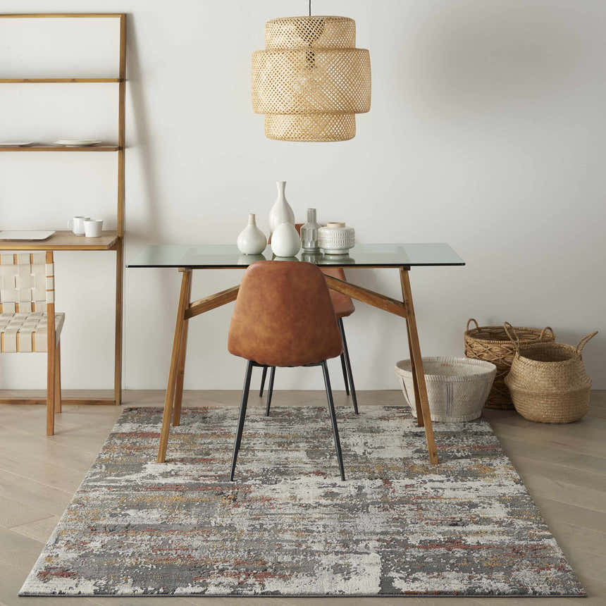 Dining room with glass table and Nourison Tangra Grey Multicolor rug. Mid-century modern style.