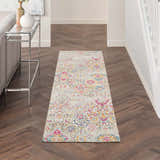 Hallway with Nourison Damask Multicolor Bohemian runner rug, wood floors, console table, and bright, airy feel.