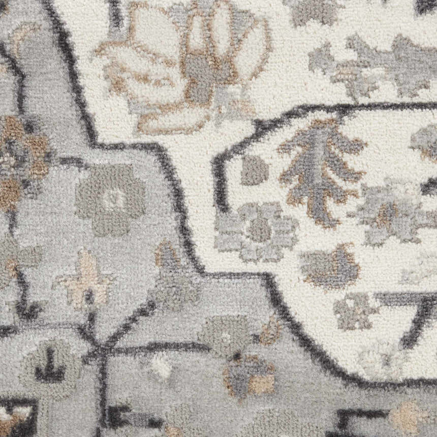 Close up of the Nourison Elation Ivory Grey rug featuring a transitional floral pattern and high pile texture.