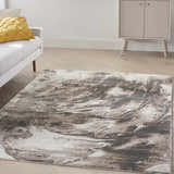 Living room scene with a Nourison American Manor Ivory Mocha rug, white sofa, yellow pillow, and mid-century cabinet.