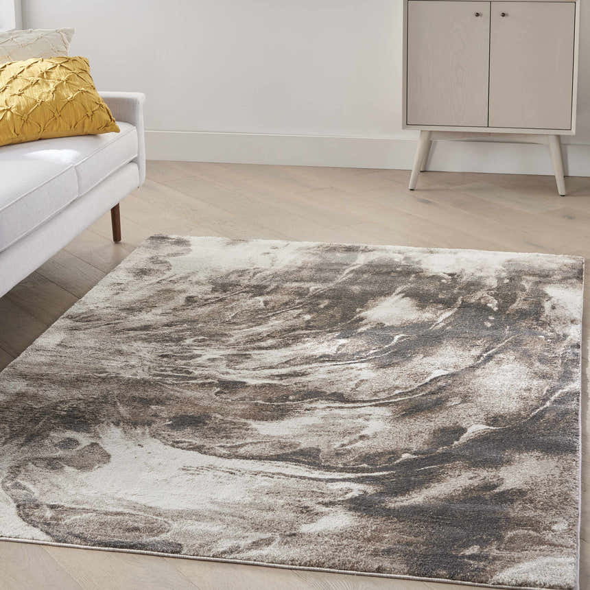 Living room scene with a Nourison American Manor Ivory Mocha rug, white sofa, yellow pillow, and mid-century cabinet.