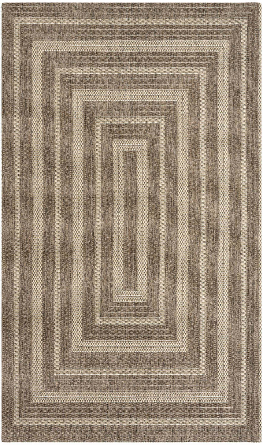 Close-up of the Nourison Tulum Brown Outdoor Area Rug showing its concentric rectangle pattern and textured weave.